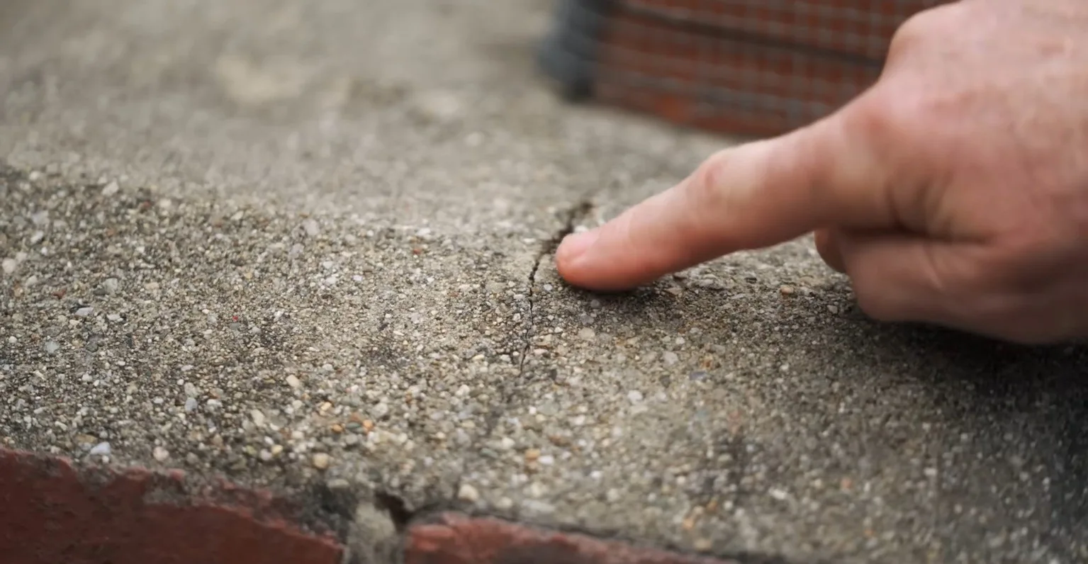 Hairline crack in a concrete chimney crown
